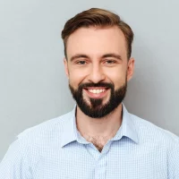 temp happy bearded man business clothes looking camera